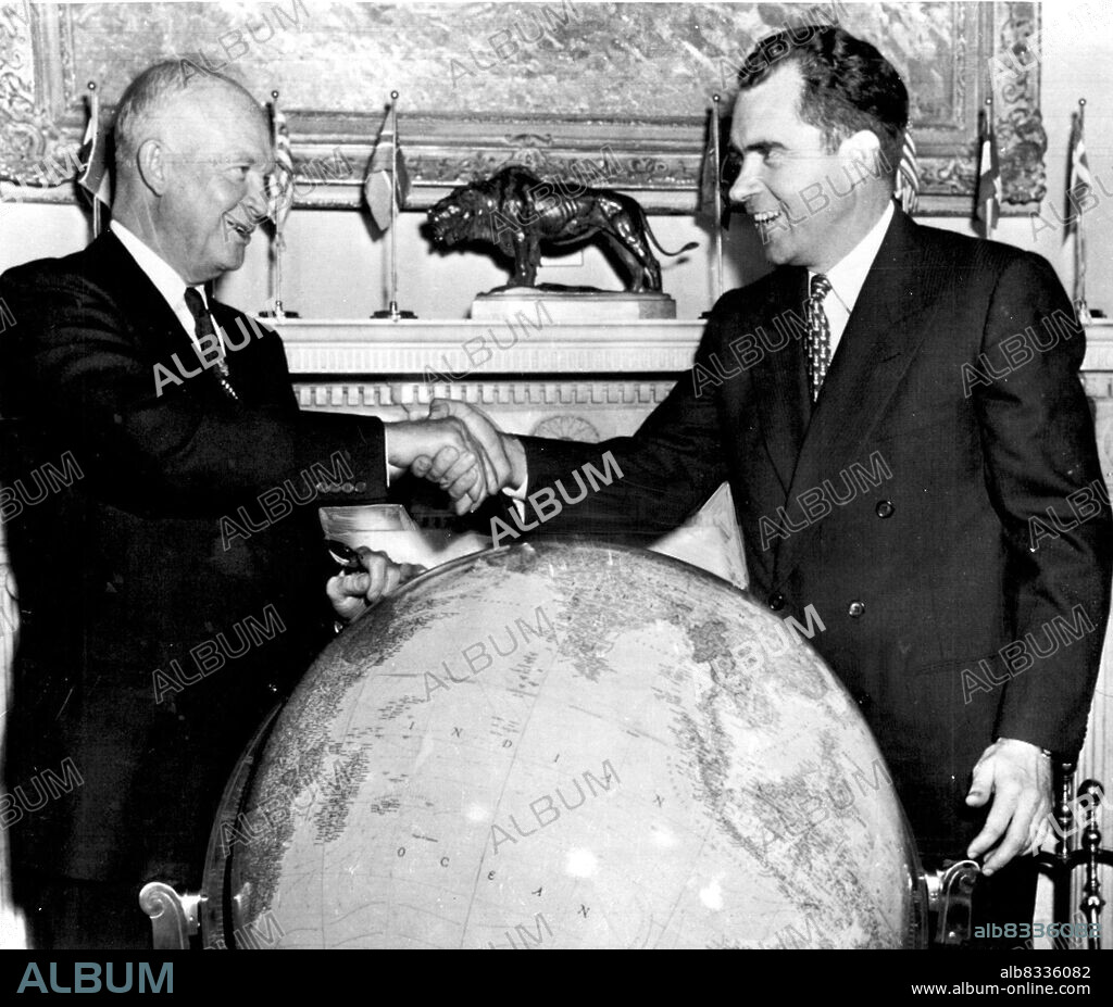 After This Shake, Around The World - President Eisenhower gives Richard Nixon a smiling handshake over the big globe at the white house today where the vice president said his farewells. Tonight at midnight, he and Mrs. Nixon begin their 'round the world trip by air. October 5, 1953. (Photo by AP Wirephoto).