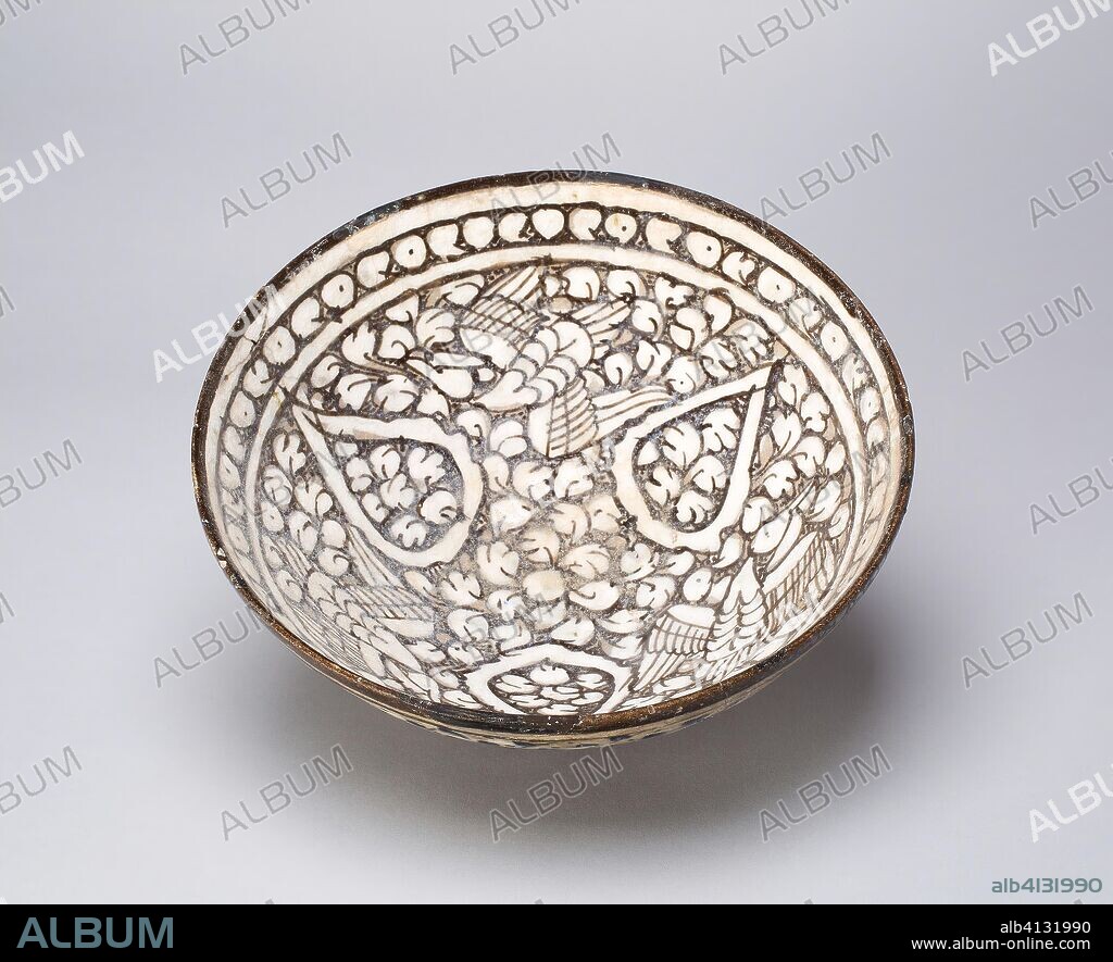 ISLAMIC. Bowl with Birds. Iran; probably Kashan. Date: 1281-1349. Dimensions: . Fritware painted with gray and white slips under a transparent glaze. Origin: Iran.