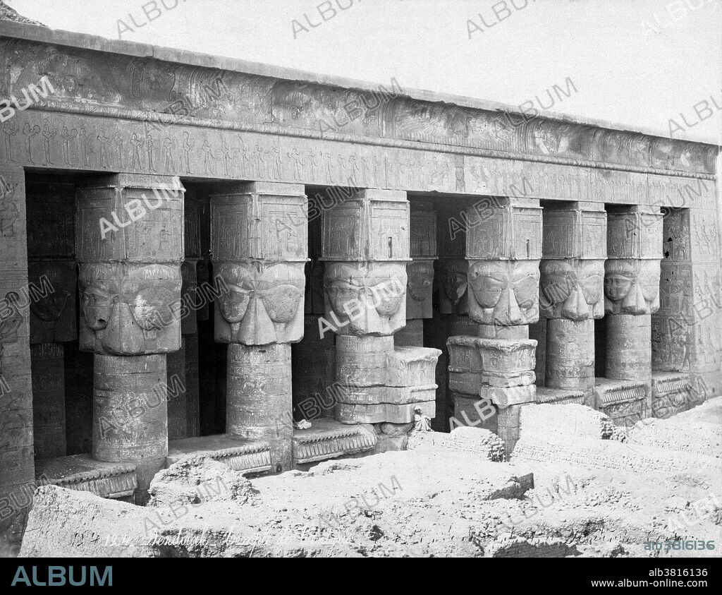 Entitled: "Upper level of temple dedicated to Hathor, located in Dendara, Egypt." Dendera Temple complex is one of the best-preserved temple complexes in Egypt. The whole complex covers almost 10 acres and is surrounded by a hefty mud brick enclosed wall. Dendera was a site for chapels or shrines from the beginning of history of ancient Egypt. The all overshadowing building in the Complex is the main temple, namely Hathor temple (historically, called the Temple of Tentyra). The temple has been modified on the same site starting as far back as the Middle Kingdom, and continuing right up until the time of the Roman emperor Trajan. The existing structure was built no later than the late Ptolemaic period. The temple, dedicated to Hathor, is one of the best preserved temples in all Egypt. Photographed by FÃ©lix Bonfils, circa 1870-80.