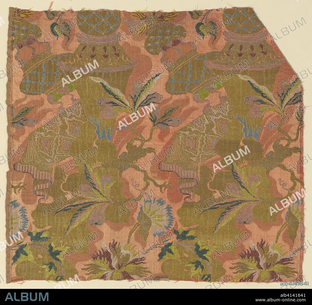 Fragment. France. Date: 1705-1706. Dimensions: 47.9 × 51.7 cm (18 7/8 × 20 3/8 in.)
Weft repeat: 25.5 cm (10-10 1/8 in.). Silk, gilt-and-silvered-metal-strip-wrapped silk, warp-float faced 7:1 satin weave with supplementary patterning wefts, supplementary brocading wefts, and self-patterned by areas of plain weave. Origin: France.