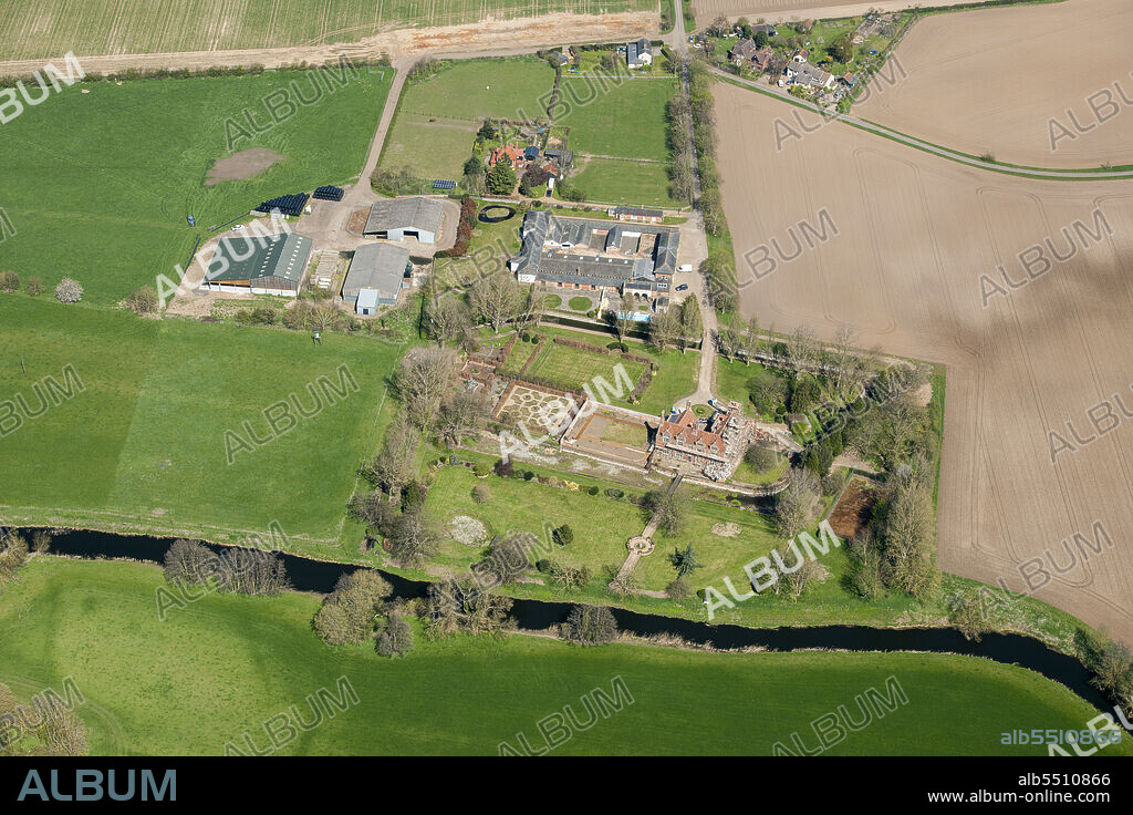 HISTORIC ENGLAND. Smallbridge Hall, a late 16th century attic house rebuilt in Elizabethan style in the late 19th century surrounded by a moat which is now only waterfilled occasionally, Bures, Suffolk, 2015.