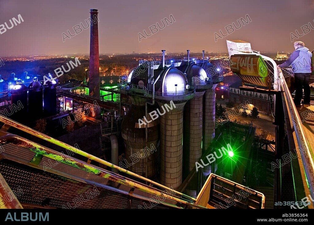 The illuminated Landschaftspark Duisburg-Nord, public park on a former industrial site, from blast furnace No 5, Duisburg, Ruhr Area, North Rhine-Westphalia, Germany