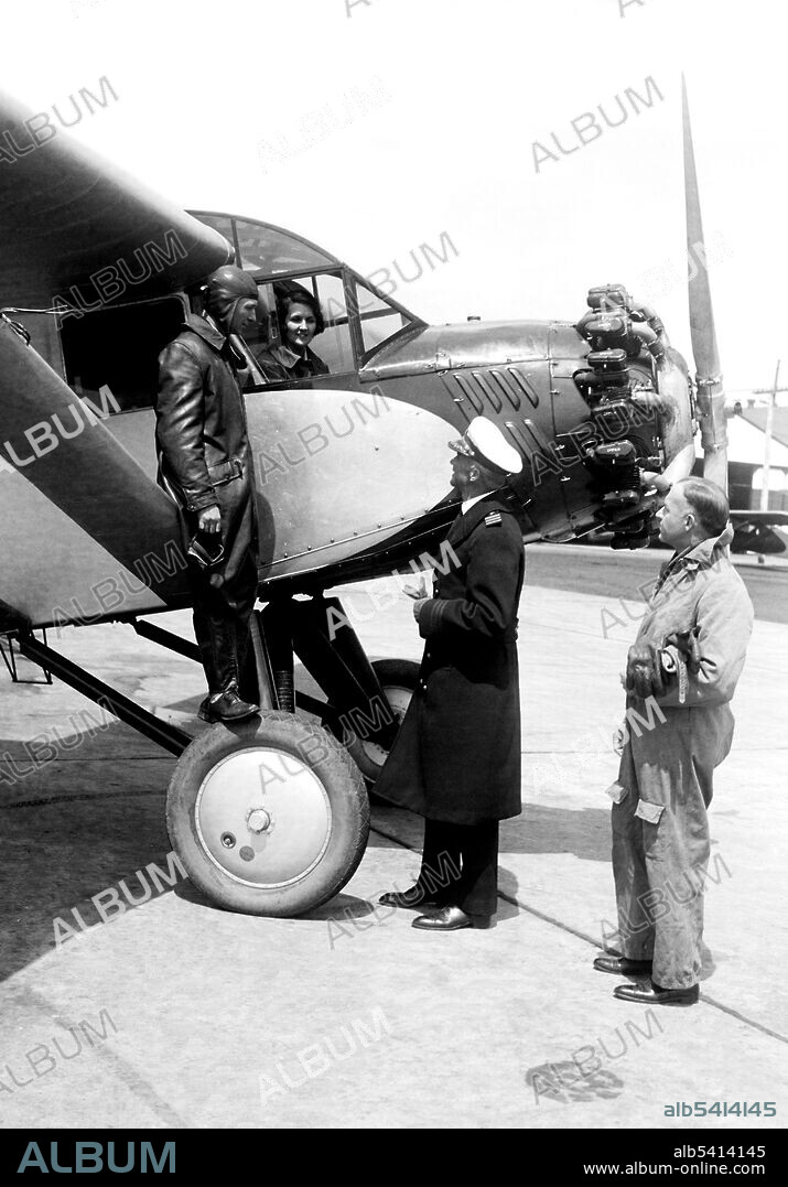 Clarence Chamberlin and Ruth Nichols (in cabin), arrived in Washington today with the new Chamberlain cabin menoplane. They are pointing out the many features of this new plane to Commander A.H. Douglas, Commandant of the Naval Air Station and Commander J.H. Towers, Assistant Chief of the Naval Bureau of Aeronautics (right). Clarence Duncan Chamberlin (November 11, 1893 - October 31, 1976) was an American pioneer of aviation, being the second man to pilot a fixed-wing aircraft across the Atlantic Ocean, from New York to the European mainland, while carrying the first transatlantic passenger. Ruth Rowland Nichols AKA the Flying Debutante (February 23, 1901 - September 25, 1960) was an American aviation pioneer. During the 1930s Nichols made several record-setting flights and was the only woman yet to hold simultaneous world records for speed, altitude, and distance for a female pilot. Harris & Ewing, April 23, 1930.