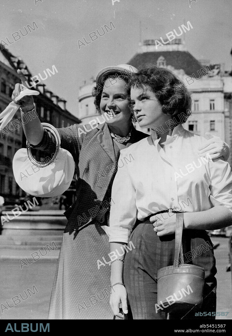 Mother and Daughter To Share Queen Victoria Roles -- Famous Filmstar Magda Schneider shows her daughter Rommy the sights of Vienna, where they are to play together in the new colour film youth of a Queen.Magda Schneider famous German star of gay films for the past twenty years. Has arrived in Vienna to play the part of Queen Victoria in a new colour film "Youth of a Queen".Magda will portray the Queen in her later days, and her 15-year-old daughter Rommy will play the part of Queen Victoria in her youth.Rommy has often acted with her mother in films and their facial resemblance will make a ideal combination for their new film. September 7, 1954. (Photo by Paul Popper, Paul Popper Ltd.).