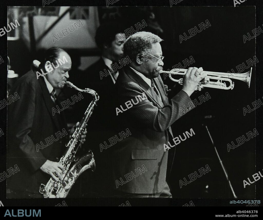 Arnett Cobb (tenor saxophone) and Wallace Davenport (trumpet) playing at the Capital Radio Jazz Festival, Knebworth, Hertfordshire, 1981. Tenor saxophonist Ricky Ford is in the background.