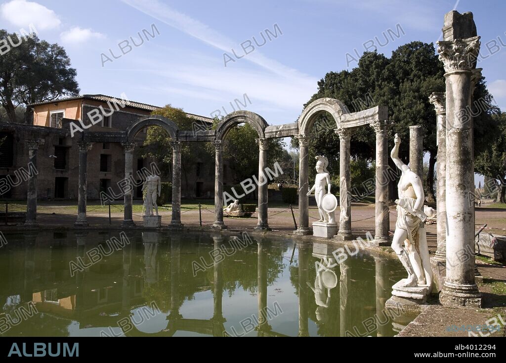 Statue of Ares/Hermes at the northern end of the Canopus, Hadrian's Villa, Tivoli, Italy. Hadrian's Villa was the luxurious retreat of Emperor Hadrian in Tibur (modern Tivoli) and was one of the most magnificent villas in the ancient world. It was built in the 2nd century AD as a home for the emperor and his court. During the later years of his reign, he actually governed the empire from the villa. The villa shows echoes of many different architectural orders, mostly Greek and Egyptian. The large Canopus pool (119 x 18 metres) was named after the canal that linked Alexandria with Canopus on the Nile delta. One of the statues that embellish the mixed architecture at the end of the semicircular Euripus at the northern end of the pool, represents a young warrior wearing a tall helmet, the so-called 'Ares', actually Hermes, recognized by the caduceus, a typical attribute of the god, traces of which are apparent on his right arm. The sculpture is a Roman copy of a Classical Greek original statue.