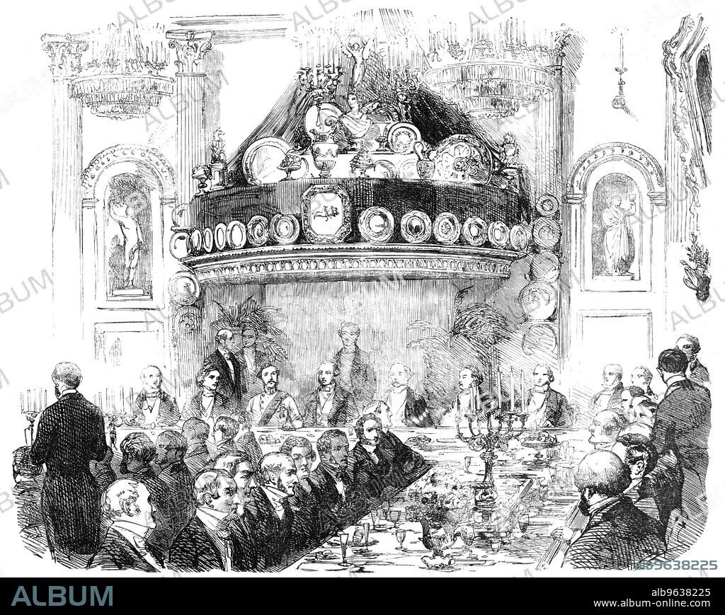 The Hon. East India Company's Banquet at the London Tavern to Lieutenant-General Patrick Grant, C.B., The New Commander-in- Chief of Madras, 1856. 'The spacious hall was magnificently decorated...The buffet called "St. George's" was nearly twenty feet in height, and, the background, being formed of rich crimson velvet, produced a gorgeous effect. The supporters of the Royal arms, in white and gold, were placed on each side, while on the top stood a figure of Victory holding a jewelled crown of gold over a bust of Her Majesty...the whole was brilliantly lighted up with a large number of wax-lights. At the centre of the head table...was an elegantly-designed plateau in solid silver, representing the Sikh chiefs delivering up their arms at the close of the campaign in 1849'. Grant was a senior Indian Army officer, and directed operations against the mutineers during the Indian Rebellion of 1857. From "Illustrated London News", 1856.