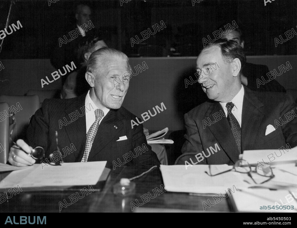 Representatives To The 10th U.N. General Assembly -- Mr. Fernand van Langenhove (left) Permanent Representative of Belgium to the United Nations, and Sir Percy Spender, Australia's Ambassador to the United States, having a spirited chat before the opening of a meeting of the Assembly's 1st (Political & Security) Committee. Both are Vice-Chairman of their delegations to the General Assembly. October 5, 1955. (Photo by United Nations).