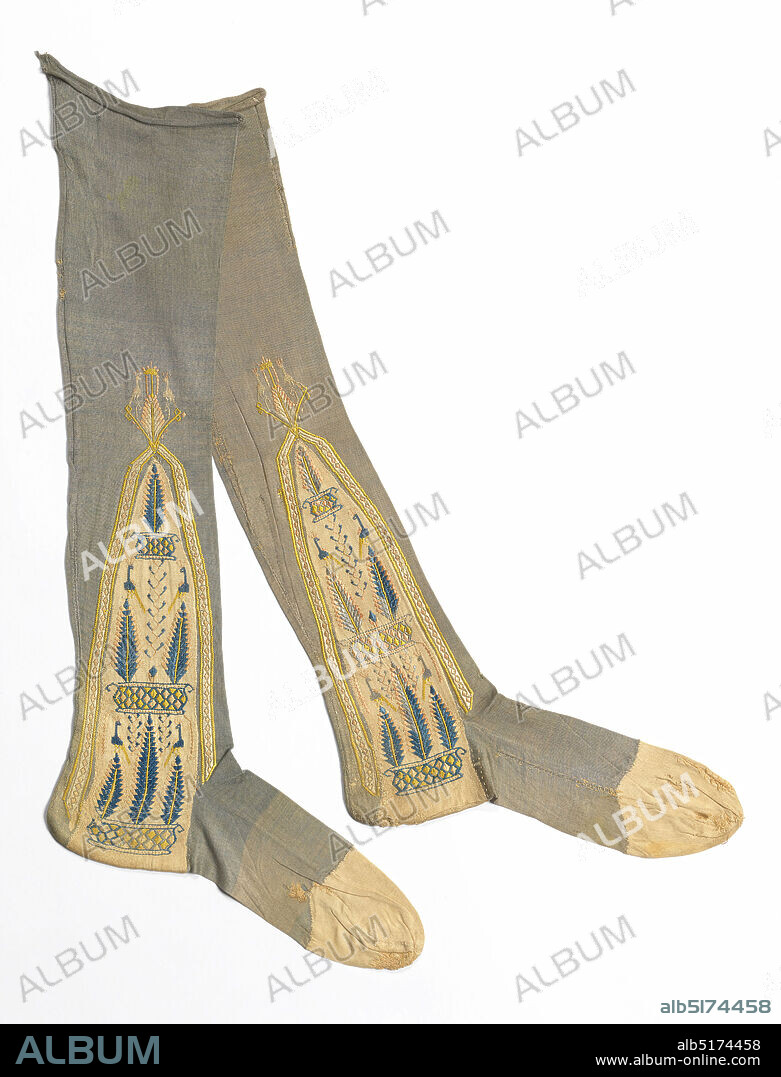 Pair of stockings, Medium: silk Technique: knitted and embroidered Label: knitted silk, embroidered with silk, Pair of gray knitted silk stockings with embroidered clocks in cream, pink, yellow and blue. The clocks have a design of a pyramid of potted trees on which peacocks are perched., France, early 19th century, knotted, knitted and crocheted textiles, Pair of stockings.