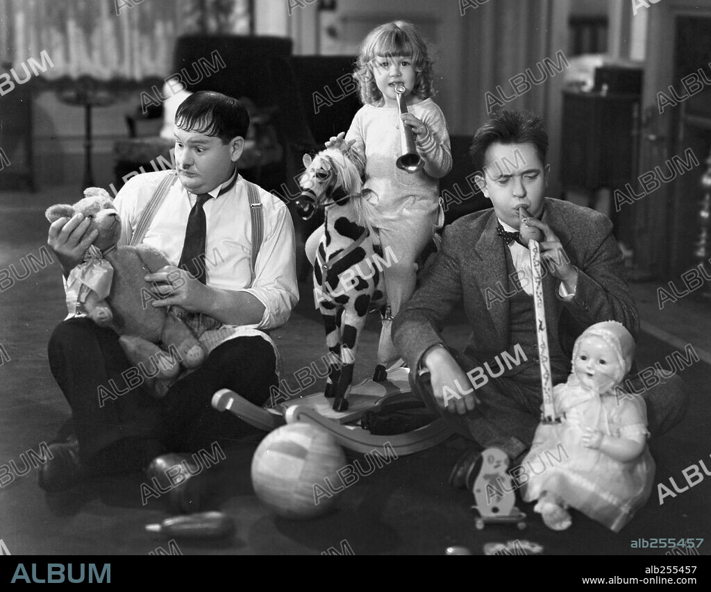 JACQUIE LYN, OLIVER HARDY and STAN LAUREL in PACK UP YOUR TROUBLES, 1932, directed by GEORGE MARSHALL. Copyright HAL ROACH/MGM.