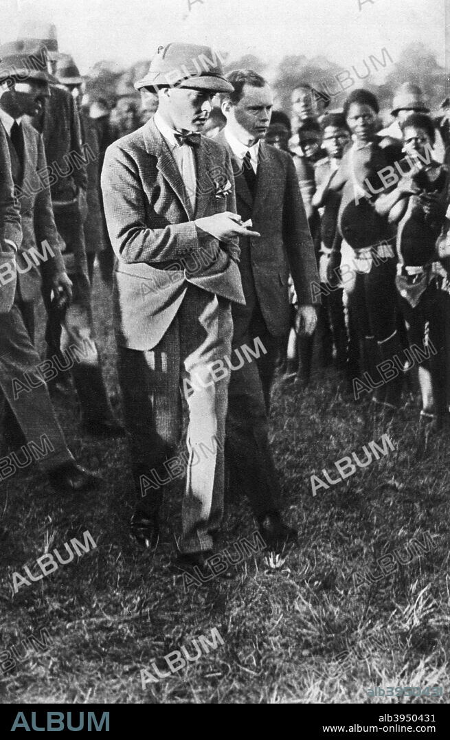 The Prince of Wales and a group of Usuta dancers, Zululand, 1925. The future King Edward VIII enjoys a cultural event during a royal visit. Illustration from George V and Edward VIII, A Royal Souvenir, by FGH Salusbury, a souvenir book published as Edward VIII was crowned following the death of his father, George V, (Daily Express Publication, London, 1936).