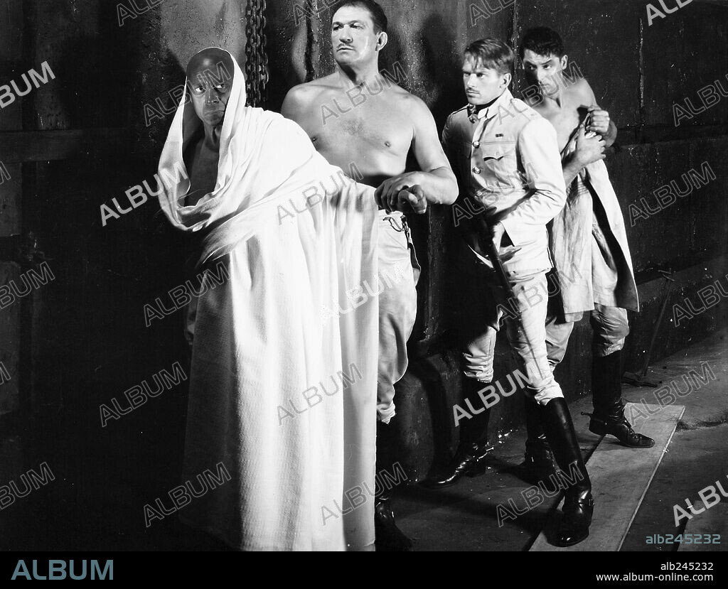 CARY GRANT, DOUGLAS FAIRBANKS JR., EDUARDO CIANNELLI and VICTOR McLAGLEN in GUNGA DIN, 1939, directed by GEORGE STEVENS. Copyright RKO.
