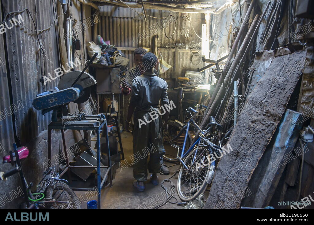 Metal smith, Medebar market, Asmara, capital of Eritrea, Africa.