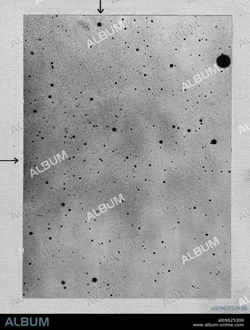 MAX WOLF. Long exposure of star field showing track of the asteroid Sappho against points of stars, 1892. Sappho's location  is identified by the arrows at the top and the left edges of the picture. On a long exposure, an asteroid shows up as a streak as it is moving relative to the surrounding stars. Sappho was first discovered in May 1864 by Pogson.