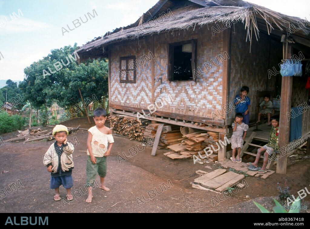 Burma / Myanmar: Village boys and house near Pyin U Lwin (Maymyo), Mandalay Region.<br/><br/>. Pyin U Lwin (Maymyo) began as a military outpost on the Lashio-Mandalay trail between Nawnghkio and Mandalay. In 1897, a permanent military post was established in the town and later, because of its climate, it became a hill station and the summer capital of British Burma.