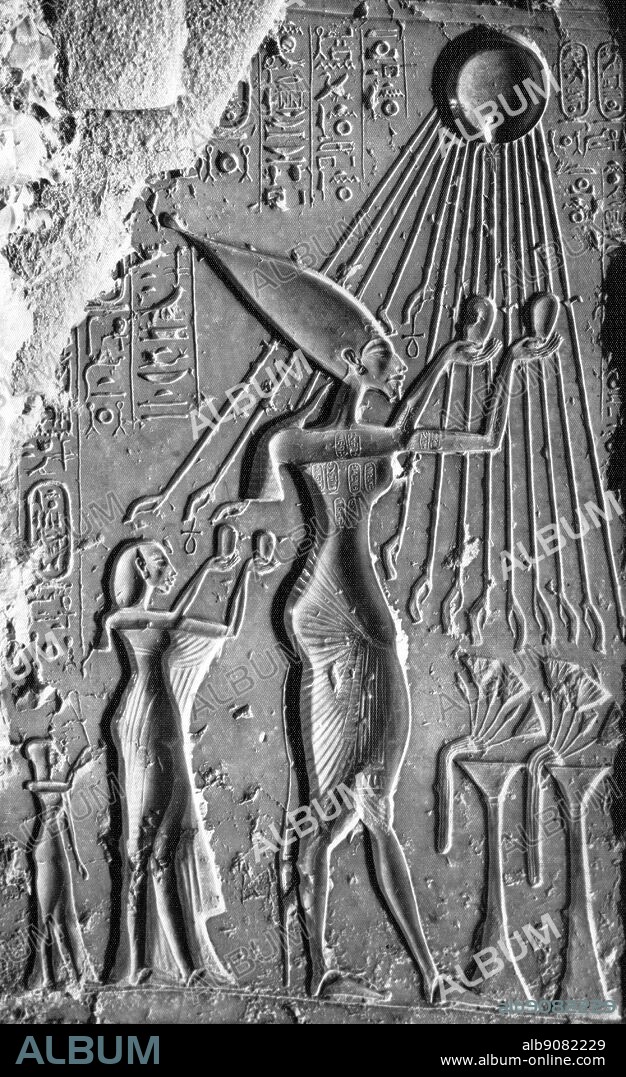 Amenophis IV, Akhenaten and Nefertiti, accompanied by a princess, make offerings to the globe of the god Aten. Tutankhamen by Christiane Desroches Noblecourt, page 129.