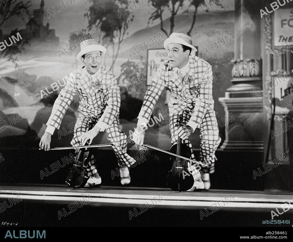 DONALD O'CONNOR and GENE KELLY in SINGIN' IN THE RAIN, 1952, directed by GENE KELLY and STANLEY DONEN. Copyright M.G.M.