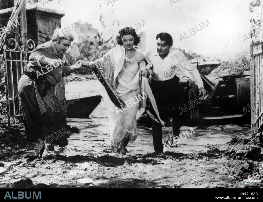 GEORGE BRENT, JANE DARWELL and MYRNA LOY in THE RAINS CAME, 1939, directed by CLARENCE BROWN. Copyright 20TH CENTURY FOX.