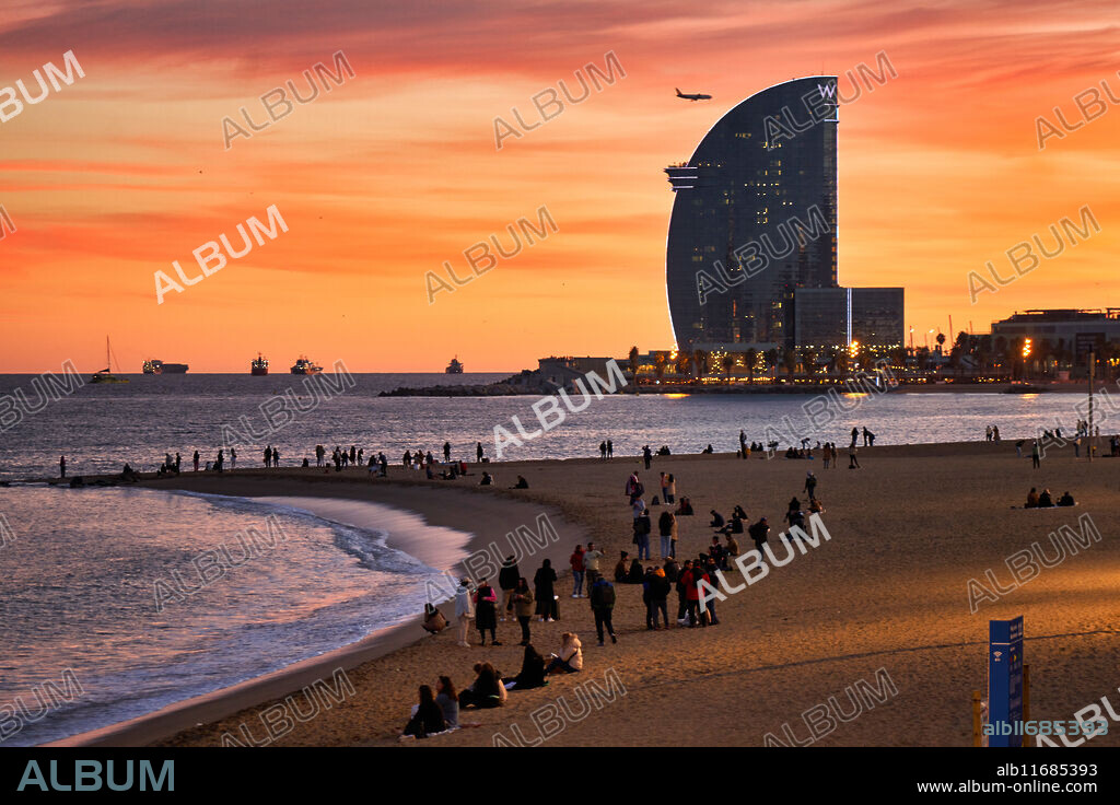Sunset at Barceloneta Beach, In the background Hotel W, Barcelona, Catalonia, Spain.