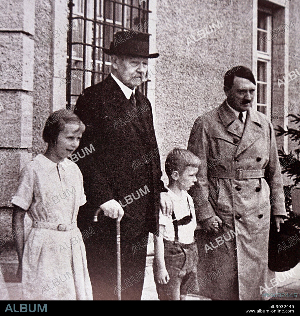 Paul von Hindenburg (President of Germany) with his grandchildren and Adolf Hitler (Chancellor). 1933.