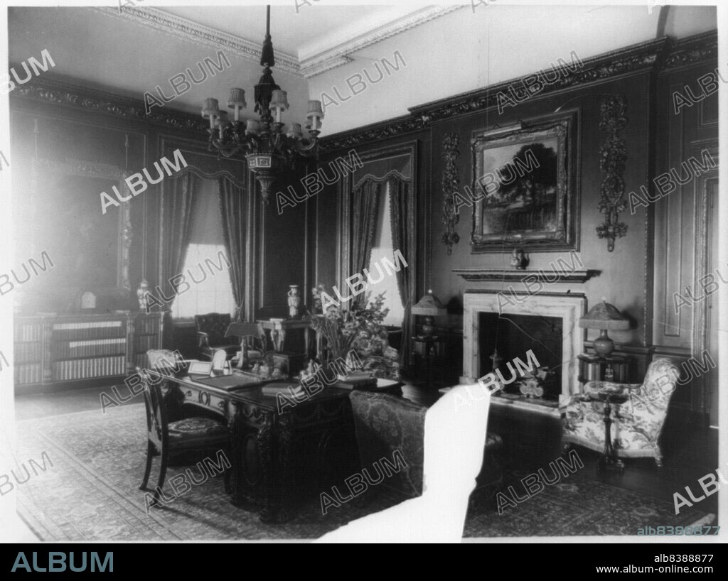 FRANCES BENJAMIN JOHNSTON. Interior view of Mrs. Hamilton Rice home in Newport, Rhode Island, with desk and fireplace, between 1917 and 1927. The Miramar neoclassical mansion was designed by Horace Trumbauer for heiress and philanthropist Eleanor Elkins Widener and her husband George Widener. After George died aboard the RMS Titanic in 1912 Eleanor married again, and Miramar was used as a summer residence by her and her second husband, geographer and explorer Alexander H. Rice Jr.