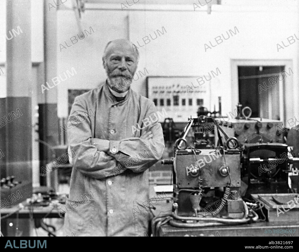 Einthoven standing beside his original string galvanometer in laboratory. Willem Einthoven (1860-1927) was a Dutch doctor and physiologist. He invented the first practical electrocardiogram (ECG or EKG) in 1903 and received the Nobel Prize in Medicine in 1924 for it. In 1901, Einthoven completed a series of prototypes of a string galvanometer. This device used a very thin filament of conductive wire passing between very strong electromagnets. When a current passed through the filament, the electromagnetic field would cause the string to move. A light shining on the string would cast a shadow on a moving roll of photographic paper, forming a continuous curve showing the movement of the string. His assignment of the letters P, Q, R, S and T to the various deflections is still used. The term "Einthoven's triangle" is named for him. It refers to the imaginary inverted equilateral triangle centered on the chest and the points being the standard leads on the arms and leg. After his development of the string galvanometer, Einthoven went on to describe the electrocardiographic features of a number of cardiovascular disorders.