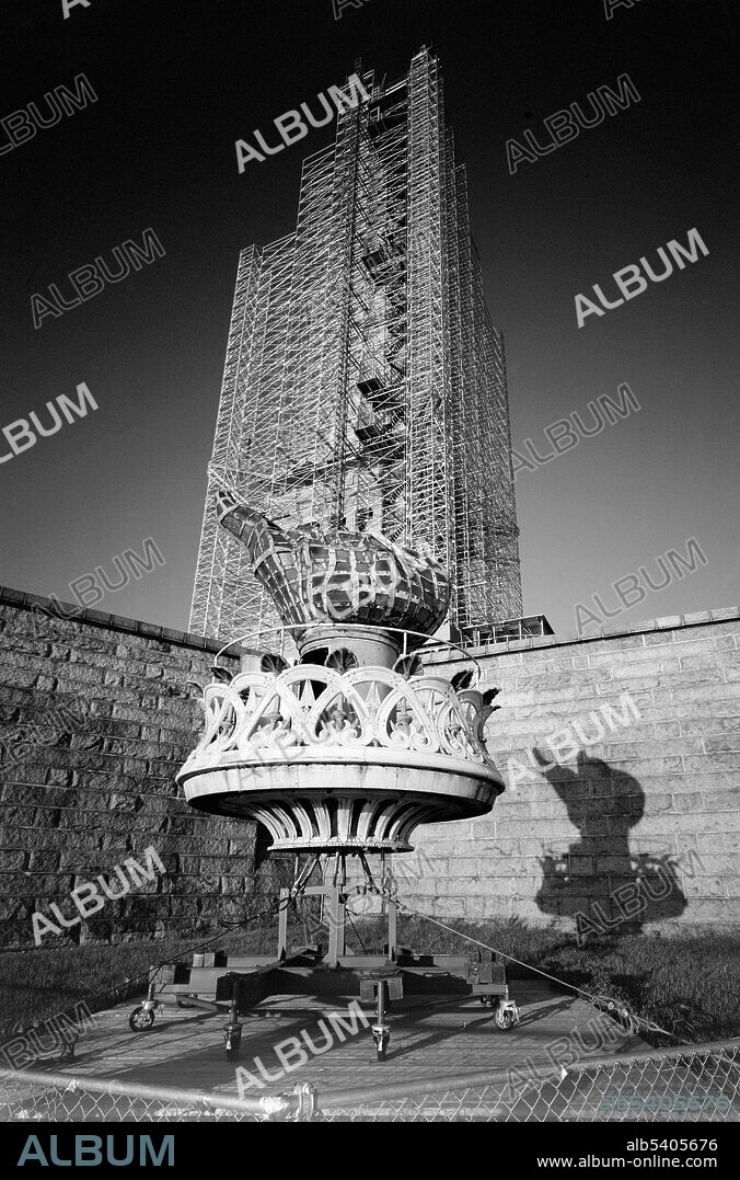 View of flame and torch platform sitting at the base of Fort Wood. A centennial conservation-restoration of the Statue of Liberty occurred between 1984-86. The Statue of Liberty, by French sculptor Frédéric Auguste Bartholdi, is a colossal artwork on Liberty Island in New York Harbor, and is a part of the Statue of Liberty National Monument. Much of the restoration effort was based on unprecedented restorative methods, as metallurgical repair work on such a large scale had never been attempted. Many scientists, engineers, government organizations, and professional consultants evaluated and dealt with the various problems and tasks facing the restoration effort. Historic American Engineering Record, Jet Lowe, 1984 (cropped and cleaned).