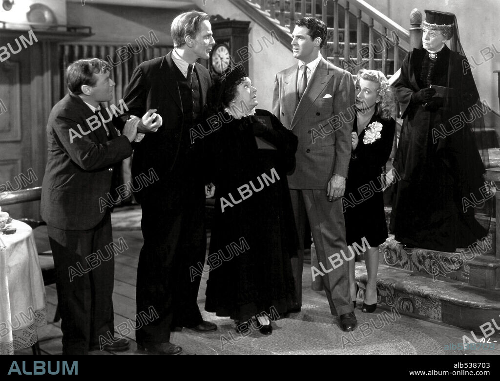 CARY GRANT, JEAN ADAIR, JOSEPHINE HULL, PETER LORRE, PRISCILLA LANE and RAYMOND MASSEY in ARSENIC AND OLD LACE, 1944, directed by FRANK CAPRA. Copyright WARNER BROTHERS.