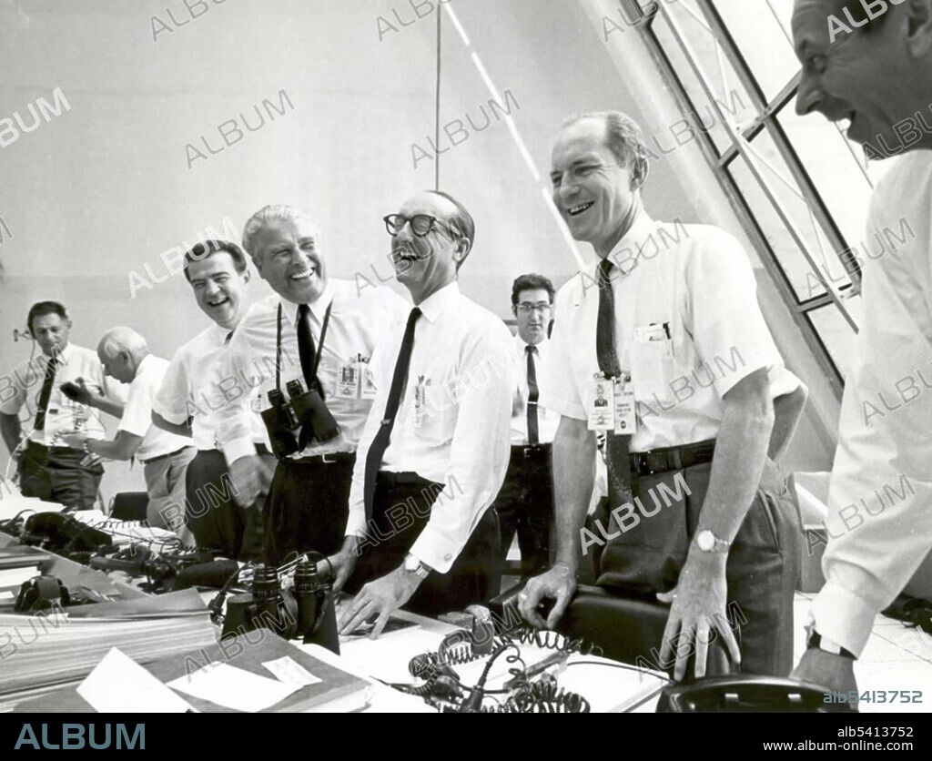 Charles W. Mathews (Deputy Associate Administrator, Office of Manned Space Flight), Dr. Wernher von Braun (Director, Marshall Space Flight Center), George Mueller, and Lt. Gen. Samuel C. Phillips (Director, Apollo Program)  relax in the Launch Control Center following the successful Apollo 11 liftoff on July 16, 1969. Apollo 11 was the spaceflight that landed the first two people on the Moon. Commander Neil Armstrong and lunar module pilot Buzz Aldrin landed the Apollo Lunar Module Eagle on July 20, 1969, at 20:17 UTC. Armstrong became the first person to step onto the lunar surface six hours later on July 21 at 02:56:15 UTC; Aldrin joined him 19 minutes later. They spent about two and a quarter hours together outside the spacecraft, and collected 47.5 pounds of lunar material to bring back to Earth. Command module pilot Michael Collins flew the command module Columbia alone in lunar orbit while they were on the Moon's surface. Armstrong and Aldrin spent 21.5 hours on the lunar surface before rejoining Columbia in lunar orbit.