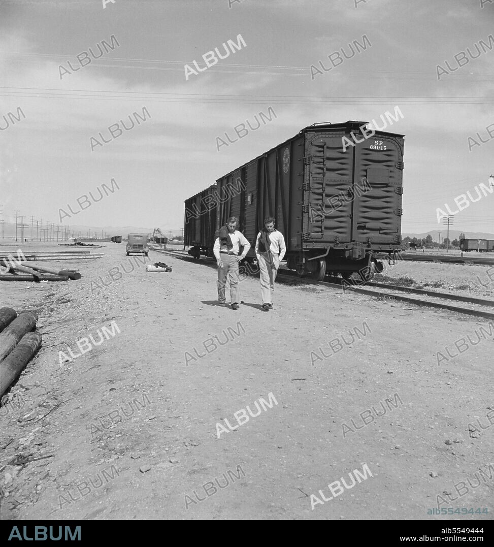 DOROTHEA LANGE. Car on siding across tracks from pea packing plant. Twenty-five year old itinerant, originally from Oregon. "On the road eight years, all over the country, every state in the union, back and forth, pick up a job here and there, travelling all the time." Calipatria, Imperial Valley.