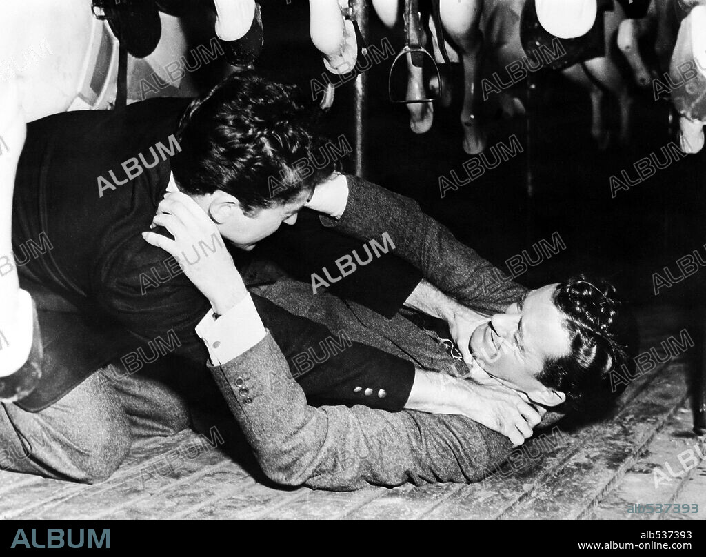 FARLEY GRANGER and ROBERT WALKER in STRANGERS ON A TRAIN, 1951, directed by ALFRED HITCHCOCK. Copyright WARNER BROTHERS.