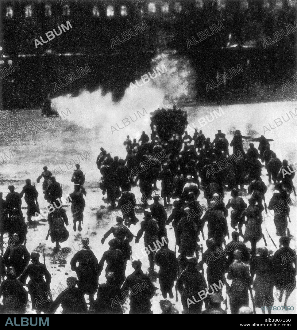 The Storming of the Winter Palace was a 1920 mass spectacle, based on historical events that took place in Petrograd during the 1917 October Revolution. Taking place on the third anniversary of the revolution, it was directed by Nikolai Evreinov and was subtitled a "mass action." The sets were designed by Yuri Annenkov. The spectacle was staged outside the former Tsarist Winter Palace where the Provisional Government was meeting at the time of the Bolshevik revolution. Its performers included 125 ballet dancers, 100 circus people, 1,750 supernumeraries and students, 200 women, 260 secondary actors, and 150 assistants. There were also tanks and armored cars involved.