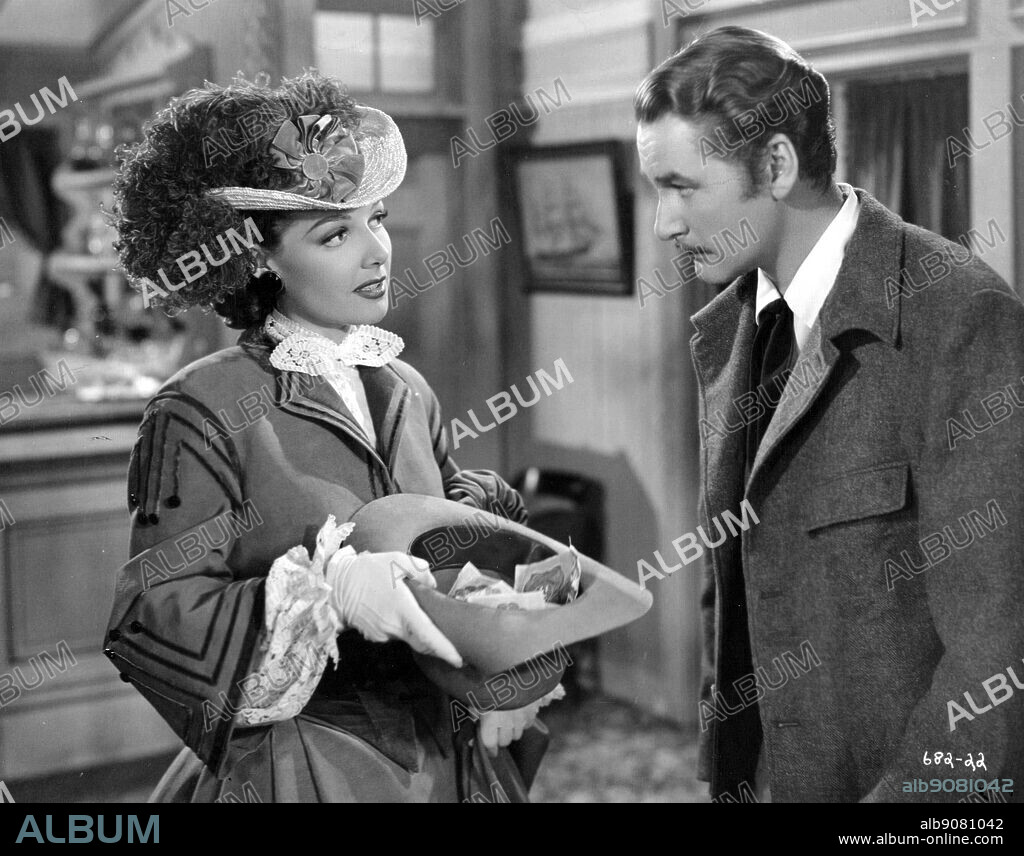 ANN SHERIDAN and ERROL FLYNN in SILVER RIVER, 1948, directed by RAOUL WALSH. Copyright WARNER BROS/FIRST NATIONAL.