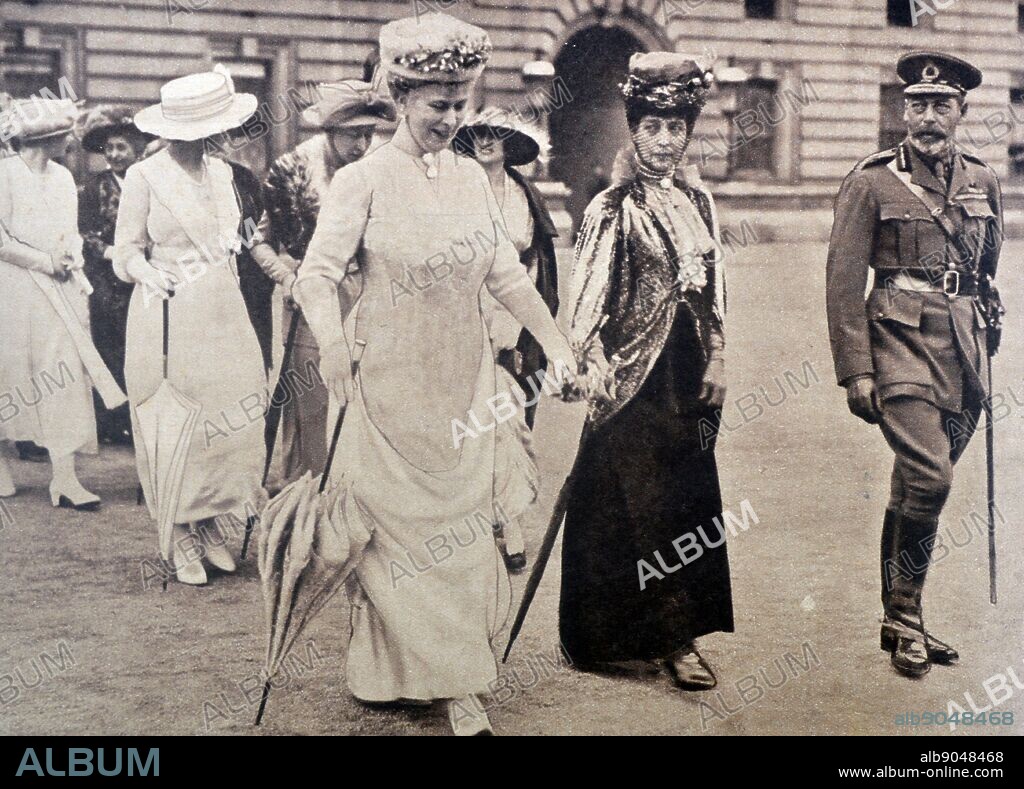 Photograph of the King George V and Queen Mary of Teck, walking with Queen Alexandra. Dated 1919.