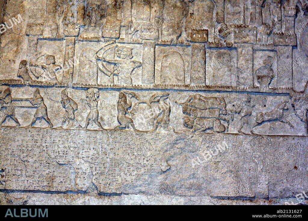 Assyrian relief. from Nimrud. Circa 8th century BC. Showing palace archers, soldiers, slaves and animals. (Photo by: Universal History Archive/UIG via Getty Images).