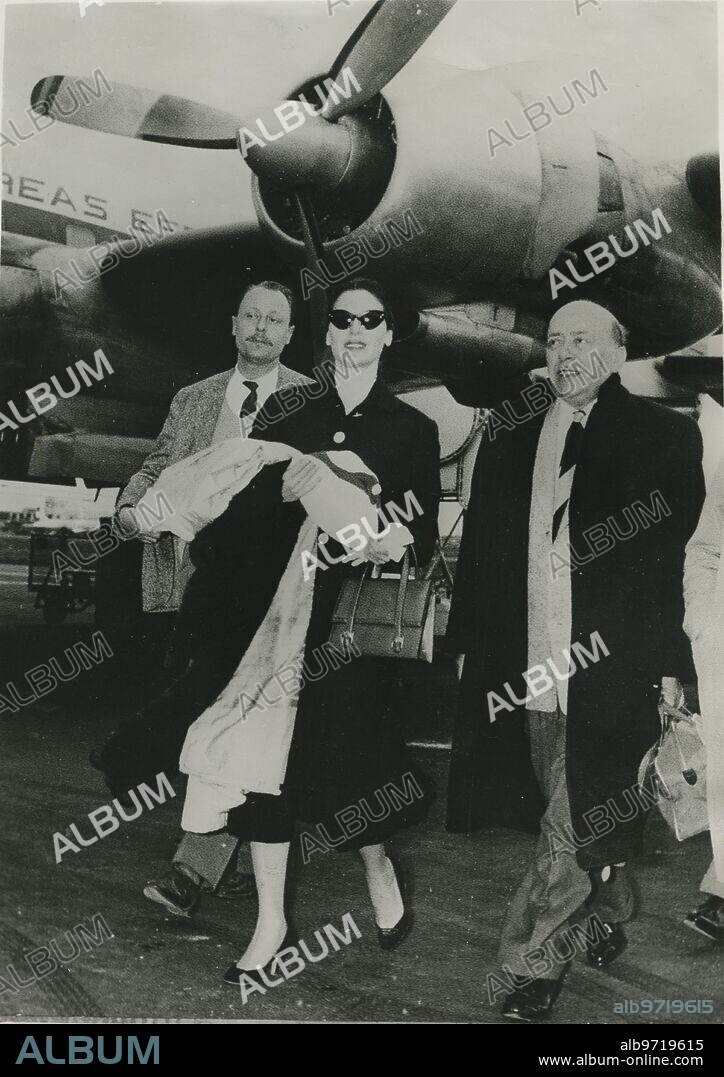 Rome, 04/09/1956. Ava Gardner accompanied by the writer Herbert Friedrich arrives in the Italian capital where she will stay a few days to attend the wedding of Rainier of Monaco and Grace Kelly in Monte Carlo.