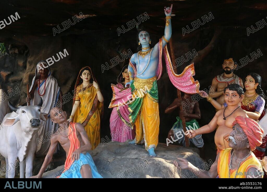 Grotto with statues depicting the life of Krishna in the courtyard of a Vrindavan temple. India.