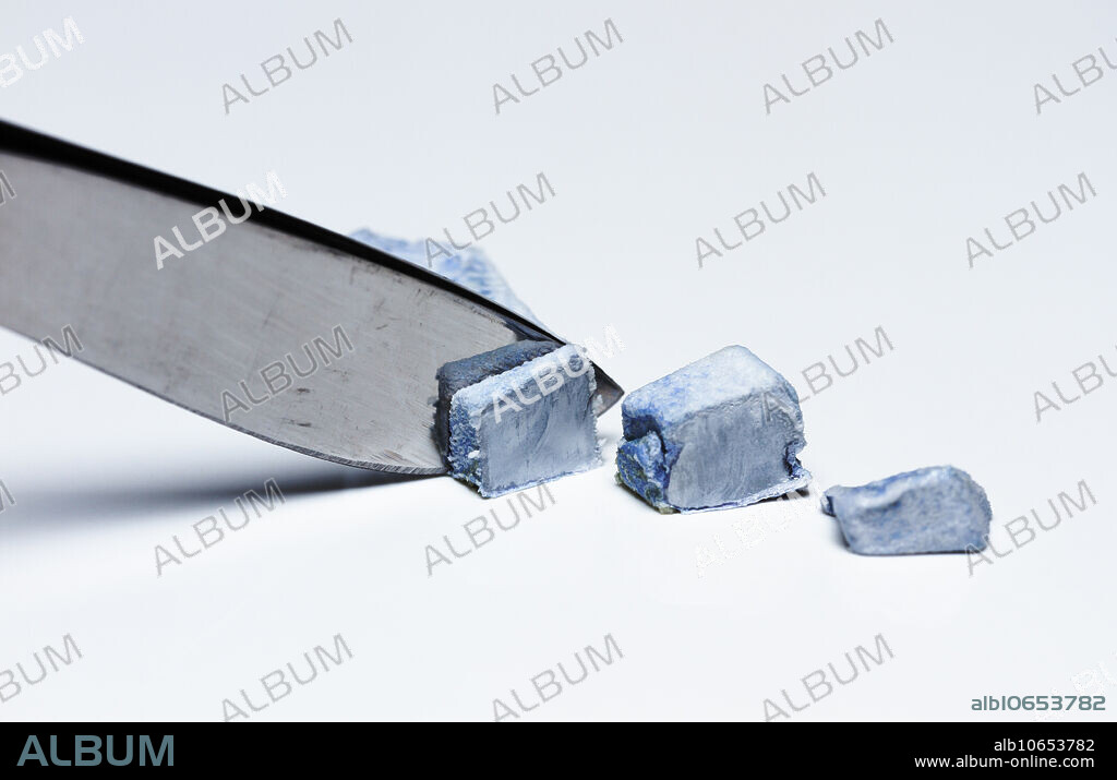 Cutting potassium, 3 of 3. Potassium (K) is a soft metal that can be cut with a scalpel blade.