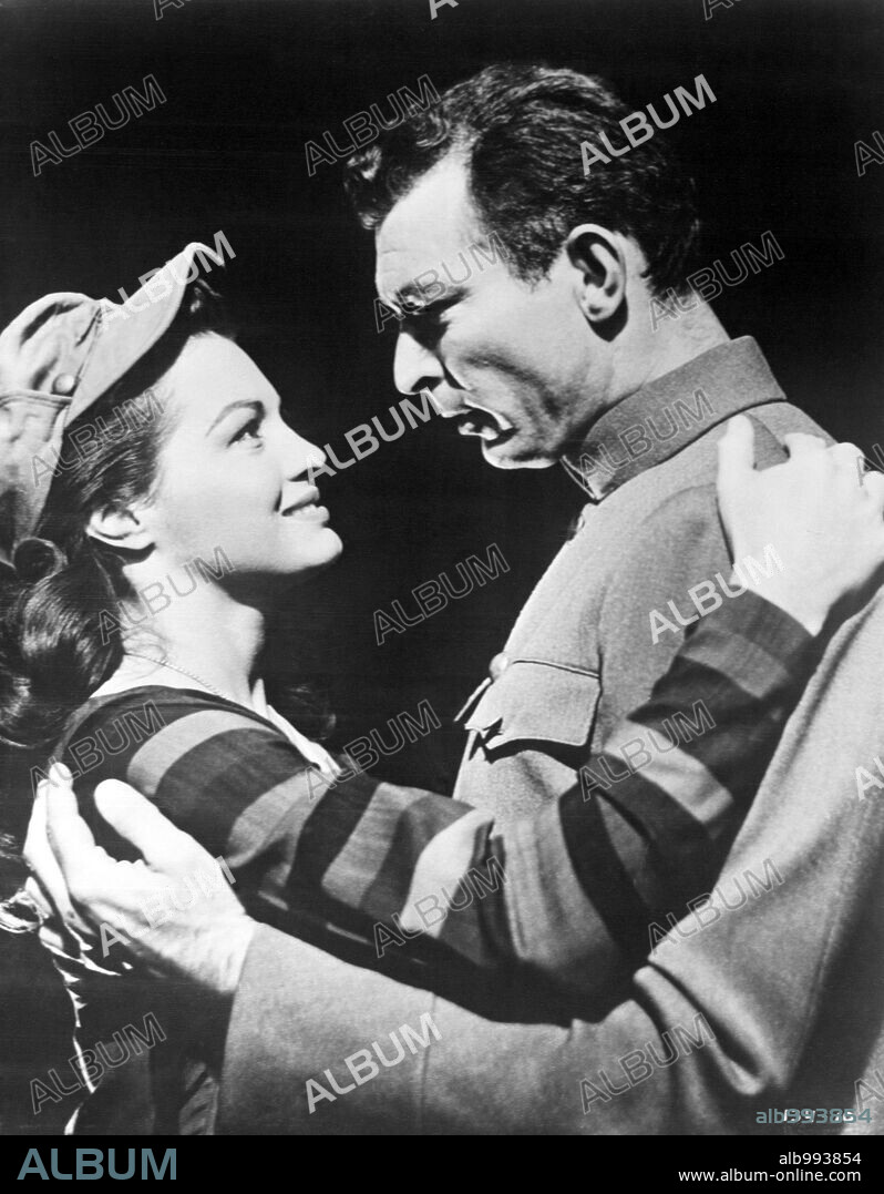 ANGIE DICKINSON and LEE VAN CLEEF in CHINA GATE, 1957, directed by SAMUEL FULLER. Copyright 20TH CENTURY FOX.
