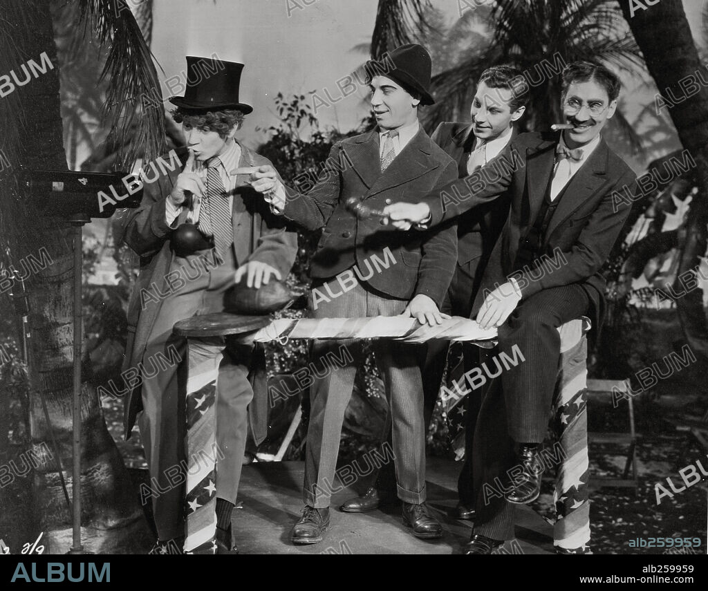 CHICO MARX, GROUCHO MARX, HARPO MARX and THE MARX BROTHERS in THE COCOANUTS, 1929, directed by JOSEPH SANTLEY and ROBERT FLOREY. Copyright PARAMOUNT PICTURES.