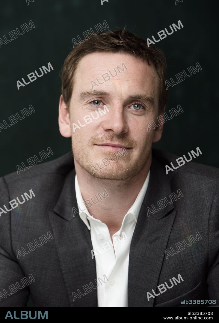 MICHAEL FASSBENDER. October 3, 2013 - MICHAEL FASSBENDER promotes 'The Counselor' at The Mayfair Hotel in London. Michael Fassbender (born April 2, 1977) is a German-born Irish actor. His feature film debut was in the fantasy war epic 300 (2007) as a Spartan warrior; his earlier roles included various stage productions, as well as starring roles on television such as in the HBO miniseries Band of Brothers (2001) and the Sky One fantasy drama Hex (2004–05). He first came to prominence for his role in Hunger (2008), for which he won a British Independent Film Award. Subsequent roles include in the independent film Fish Tank (2009), as a Royal Marines lieutenant in Inglourious Basterds (2009), A Dangerous Method (2011), Prometheus (2012), and in the musical comedy-drama Frank (2014), The Snowman (2017), Alien Covenant (2017), Song to Song (2017. 03/10/2013