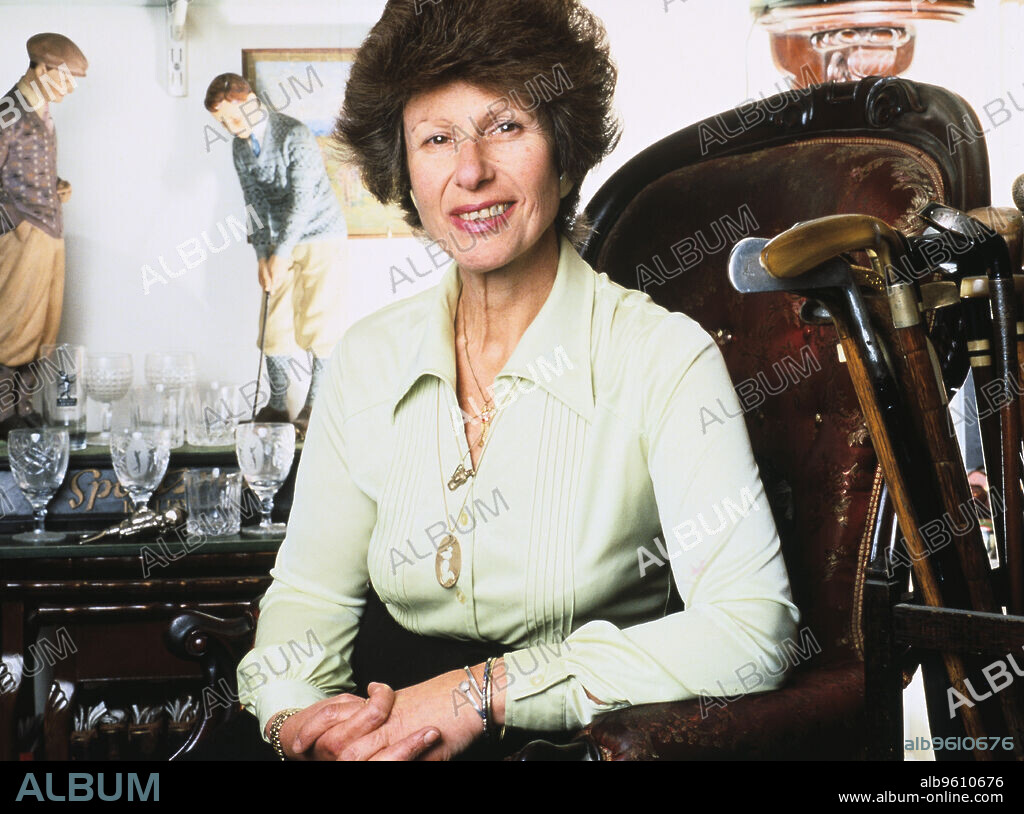 Author Sarah Fabian Baddiel at home with her collection of golfiana.