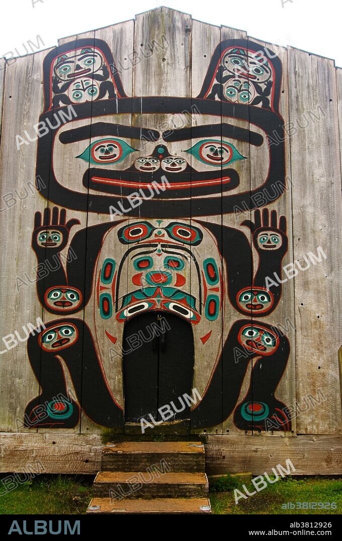 Chief Shakes Tribal House, a 1939 replica of a Tlingit clan house on Shakes Island in Wrangell Harbor, Southeast Alaska. The many faces painted on the body of the central figure represent the natives' belief that each individual part of the body could be inhabited by a spirit.