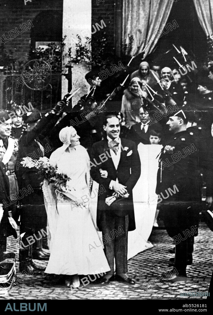 The Mussolini Wedding:
An exclusive picture showing the bride and bridegroom, saluted by Fascieti, leaving the Church of S. Guiseppe, Rome, after their marriage. July 02, 1930.