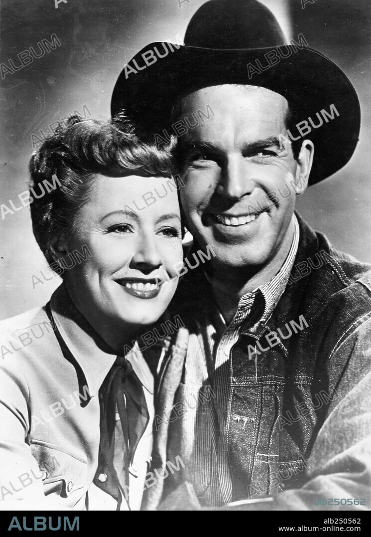 FRED MACMURRAY and IRENE DUNNE in NEVER A DULL MOMENT, 1950, directed by GEORGE MARSHALL. Copyright RKO.