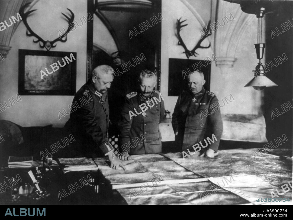 Photograph shows General Paul von Hindenburg, Kaiser Wilhelm II, and General Erich Ludendorff standing at a table, examining large maps, circa 1914-18. Wilhelm II (January 27, 1859 - June 4, 1941) was the last German Kaiser and King of Prussia, ruling the German Empire and the Kingdom of Prussia from 1888 to 1918. Crowned in 1888, he dismissed the Chancellor, Otto von Bismarck, in 1890 and launched Germany on a "New Course" in foreign affairs that culminated in his support for Austria-Hungary in the crisis of July 1914 that led to World War I. Bombastic and impetuous, he sometimes made tactless pronouncements on sensitive topics without consulting his ministers, culminating in a disastrous Daily Telegraph interview that cost him most of his power in 1908. His top generals, Paul von Hindenburg and Erich Ludendorff, dictated policy during World War I with little regard for the civilian government. An ineffective war leader, he lost the support of the army, abdicated in November 1918, and fled to exile in the Netherlands where he died in 1941 at the age of 82.
