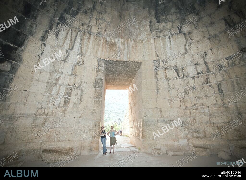 The Treasury of Atreus (Tomb of Agamemnon), Mycenae, Greece. The Treasury of Atreus is a tholos tomb which dates from the Middle Mycenaean period (1500-1425 BC). Mycenae is an archaeological site in Greece, located about 90 km southwest of Athens, in the northeastern Peloponnese. In the second millennium BC Mycenae was one of the major centres of Greek civilisation, a military stronghold which dominated much of southern Greece. The period of Greek history from about 1600 BC to about 1100 BC is called Mycenaean in reference to Mycenae.