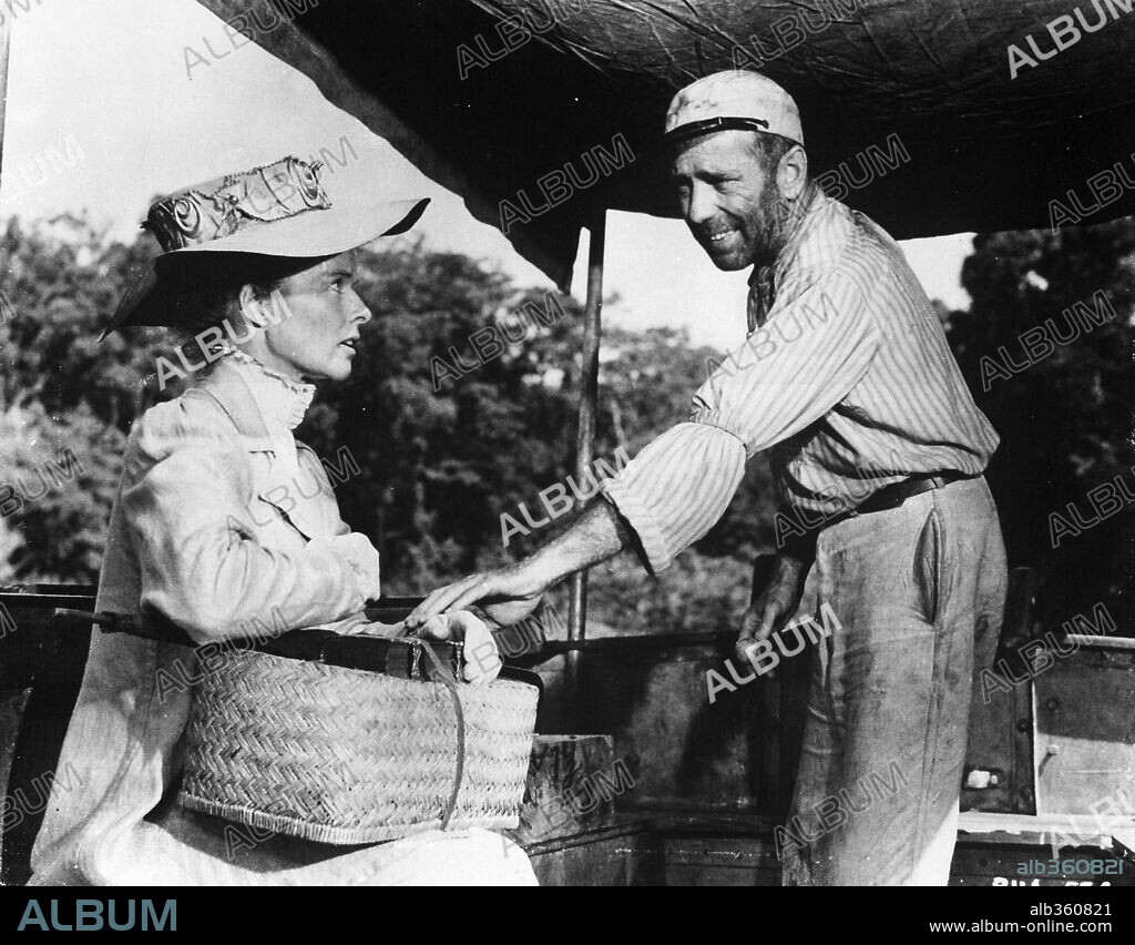 HUMPHREY BOGART and KATHARINE HEPBURN in THE AFRICAN QUEEN, 1951, directed by JOHN HUSTON. Copyright UNITED ARTISTS.