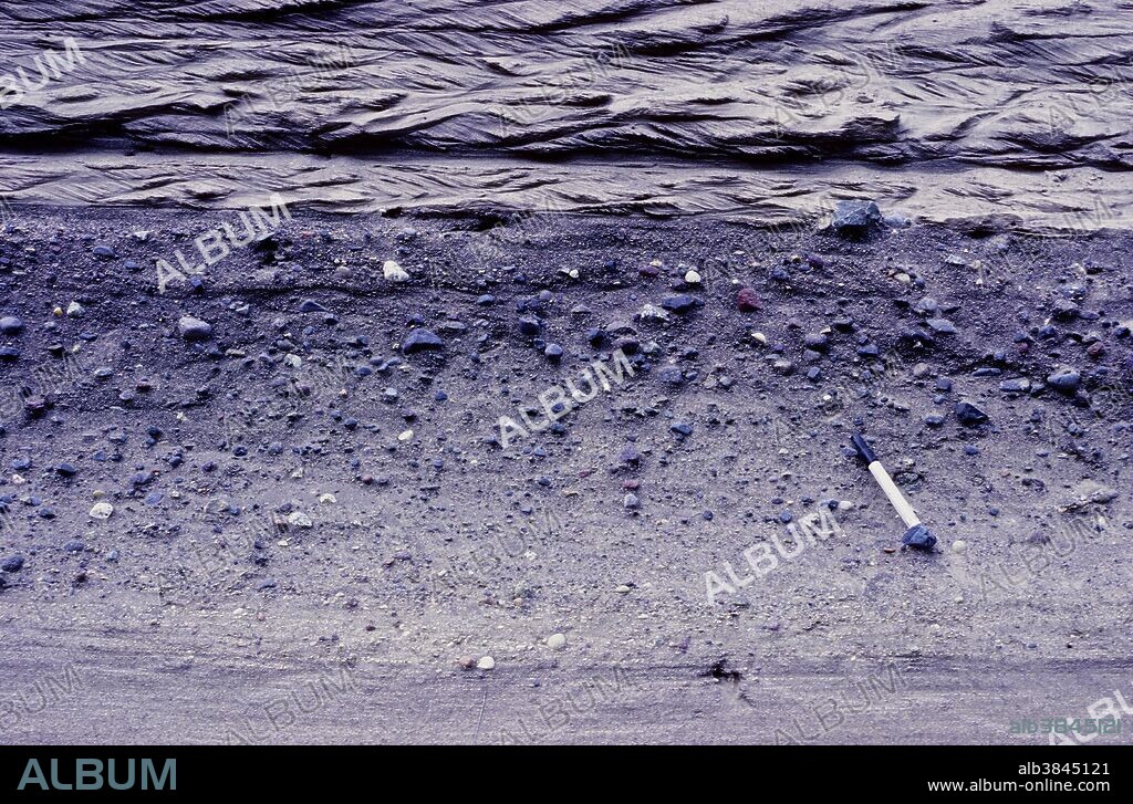 Reverse graded bedding (grains coarsen upwards) in fluvioglacial outwash sediments, British Columbia, Canada.