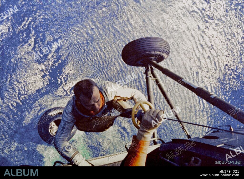 Mercury-Redstone 3 was the first US human spaceflight, on May 5, 1961, piloted by astronaut Alan Shepard. It was the first manned flight of Project Mercury, the objective of which was to put an astronaut into orbit around the Earth and return him safely. His mission was a 15-minute suborbital flight with the primary objective of demonstrating his ability to withstand the high g forces of launch and atmospheric re-entry. He named his space capsule Freedom 7, setting a precedent for the remaining six Mercury astronauts naming their spacecraft. His spacecraft reached an altitude of 101.2 nautical miles and traveled a downrange distance of 263.1 nautical miles. During the flight, Shepard observed the Earth and tested the capsule's attitude control system, turning the capsule around to face its blunt heat shield forward for atmospheric re-entry. After re-entry, the capsule landed by parachute on the Atlantic ocean off the Bahamas. Shepard and the capsule were picked up by helicopter and brought to an aircraft carrier.